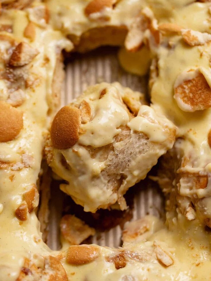 "banna pudding with vanilla wafers being scooped out"