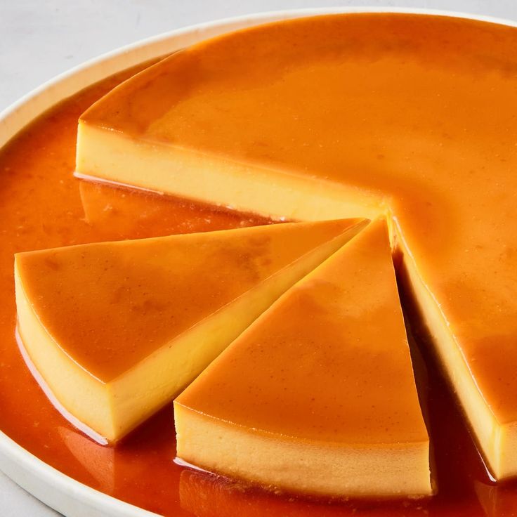 "silky and smooth flan cut into slices with caramel around"