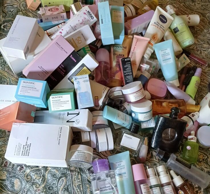 "Chaotic collection of skincare sample items, highlighting the clutter of products received in a beauty subscription box"